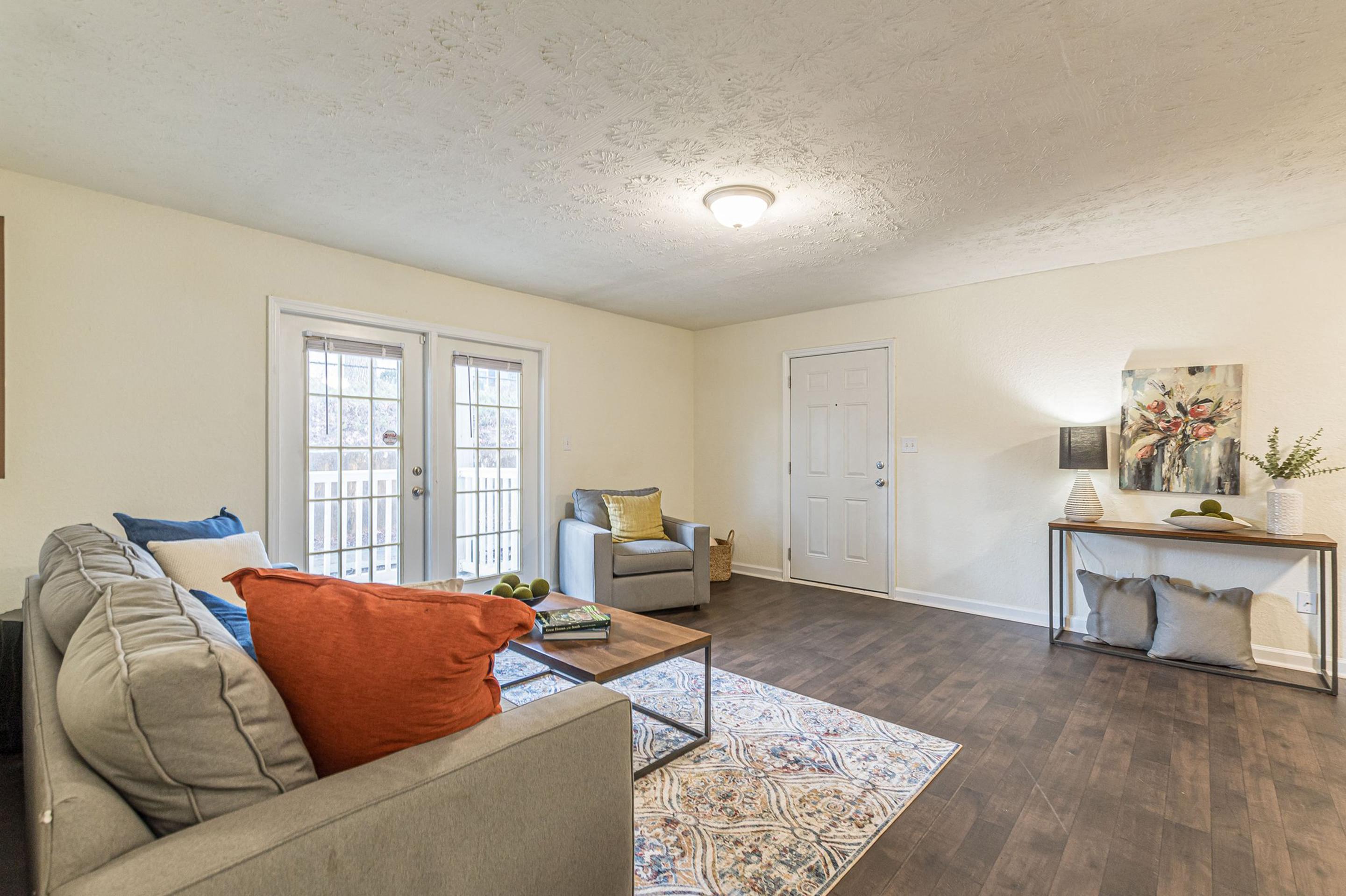 the living room of a home with a couch and a coffee table